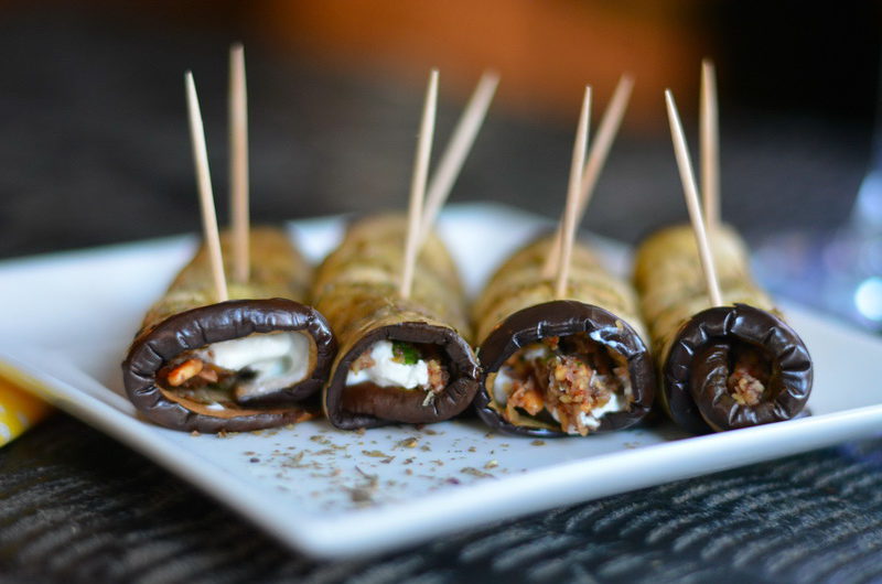 Rolled eggplant bites with olive-almond tapenade and feta cheese 