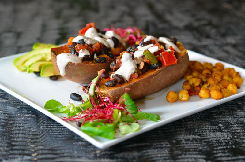 Baked sweet potato boats with black bean & tomato stuffing