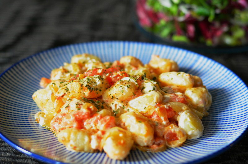 Creamy Gnocchi with caramelized onion and tomatoes