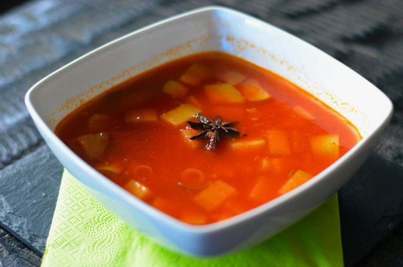 Aromatic ginger & zucchini soup with tomato and spices 