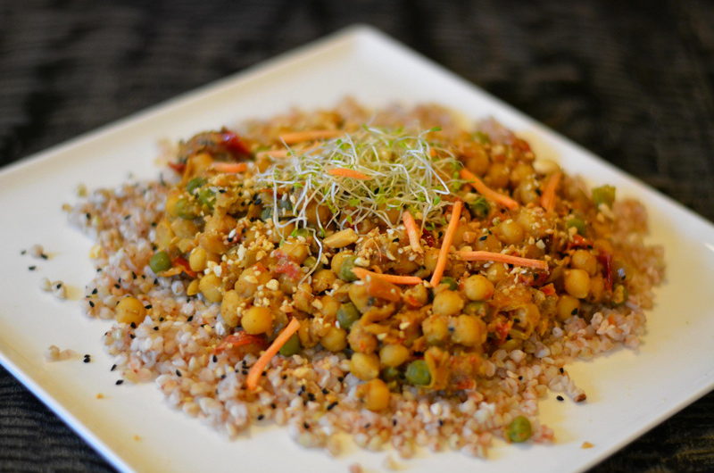Chickpeas in crunchy peanut sauce with peas and dried tomatoes